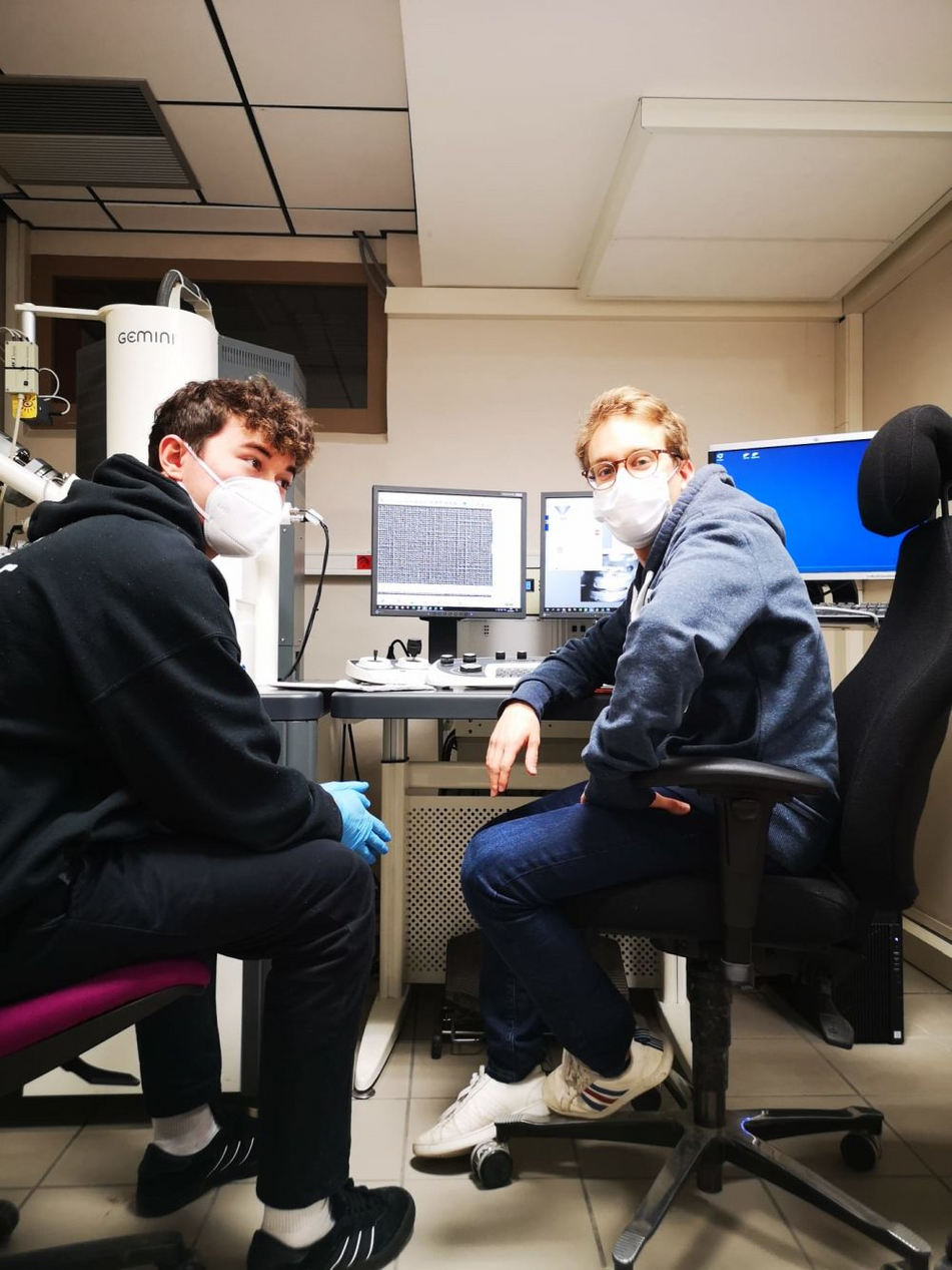 Adam (ESR 11) during his secondment at INSA Lyon (France). In this photo together with Yohan (ESR 14) doing surface characterization (SEM) of samples to be tested for biocompatibility.