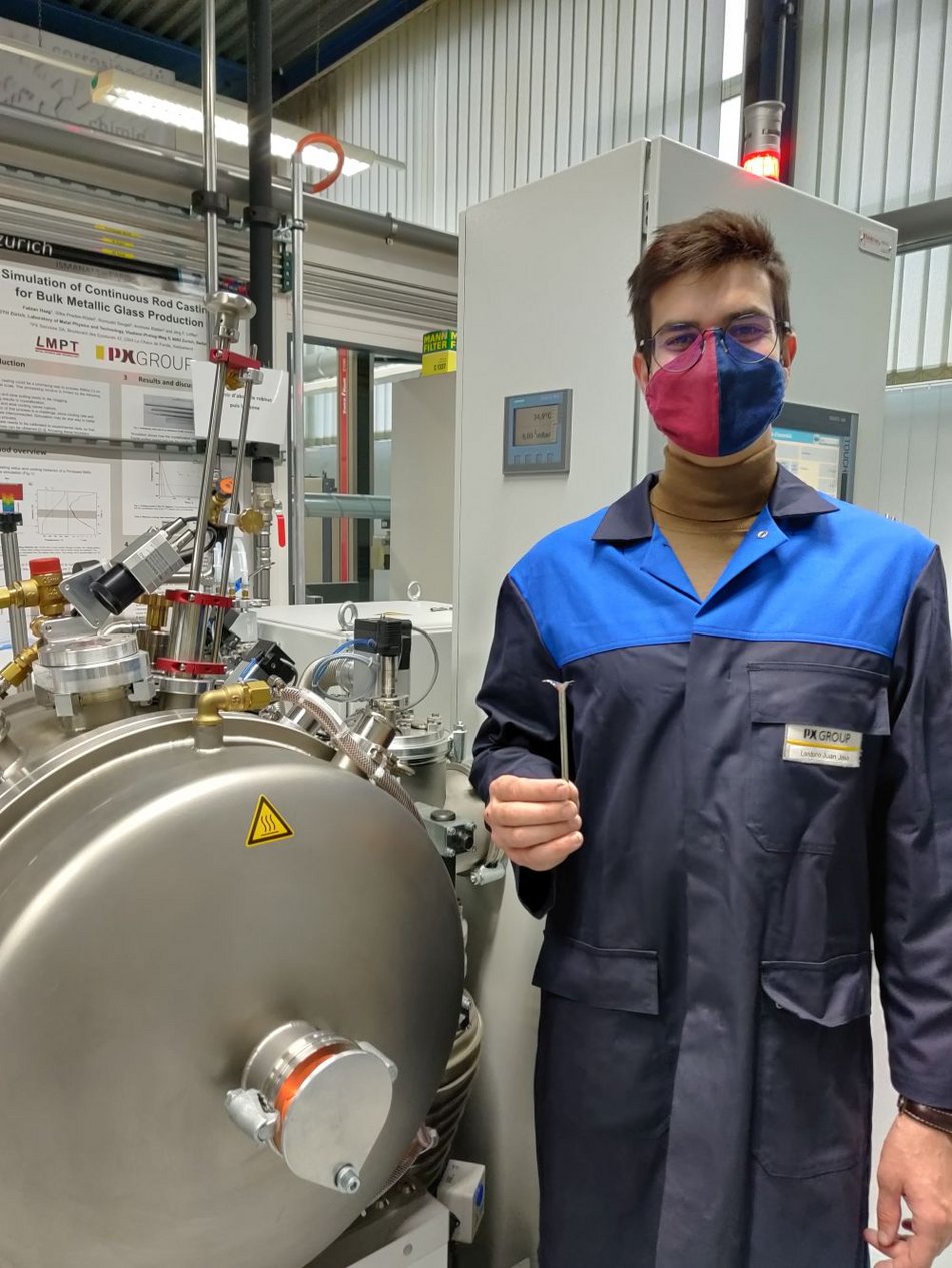 Miguel at PXS (Switzerland) holding a successful casting of a metallic glass.