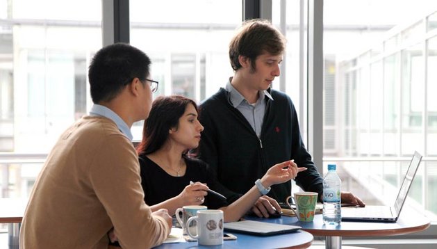 PhD students discussing a topic