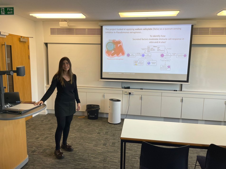 Paula on secondment at UCAM presenting her research. October 2022.