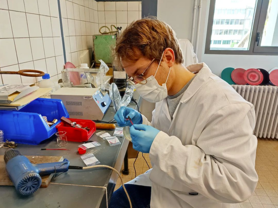 Yohan (ESR 14) in the metallography facility of INSA Lyon (France) preparing samples for electrochemical testing.