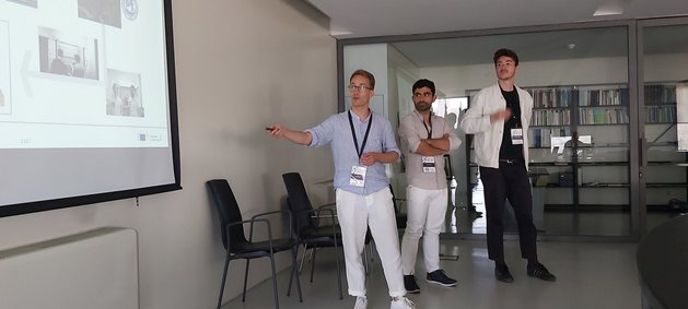 Yohan, Ludovico and Adam talking about their secondments during the bioremia satellite event at the Junior EUROMAt conference in Coimbra, Portugal